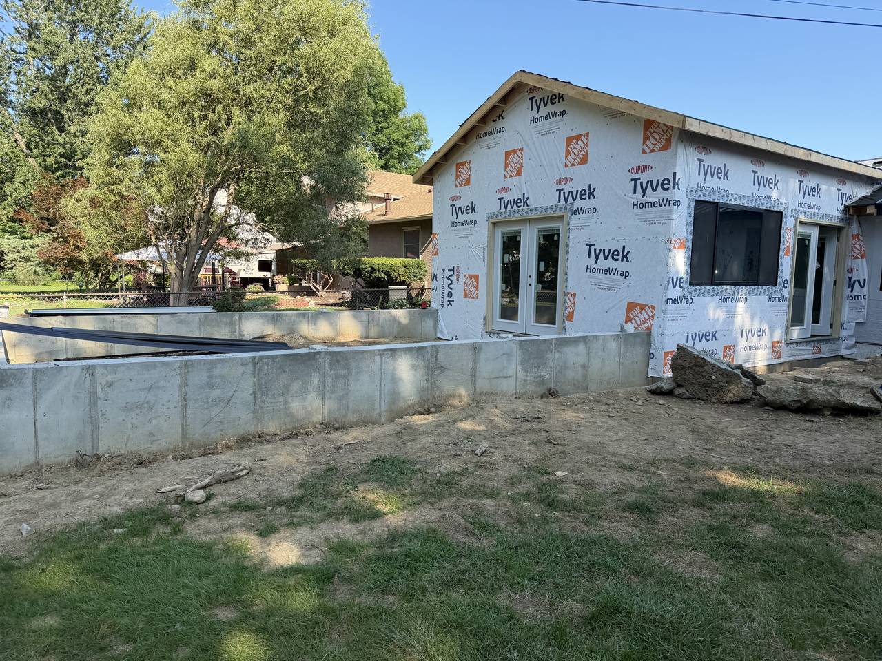 Completed CMU block foundation wall with framing started above