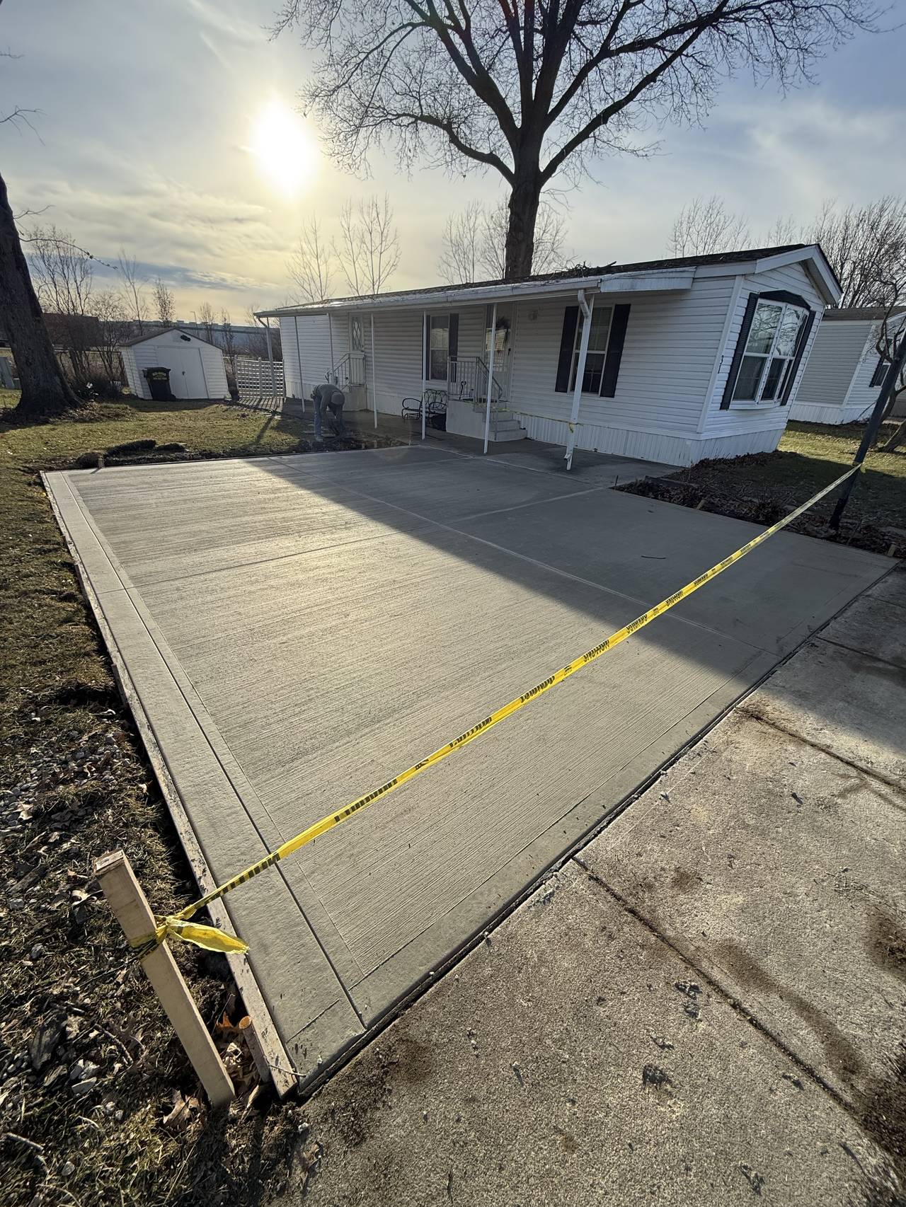 Concrete driveway extension at a mobile home community