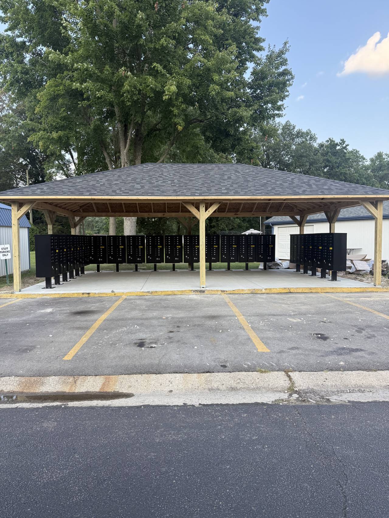 Community mail kiosk pavilion on a concrete pad