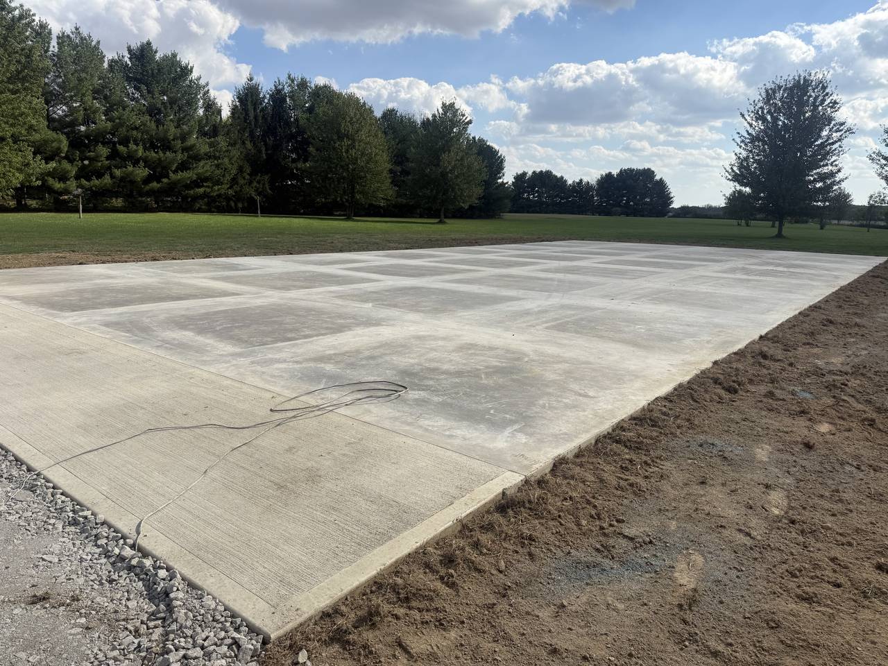 Large slab-on-grade concrete pad in a rural setting