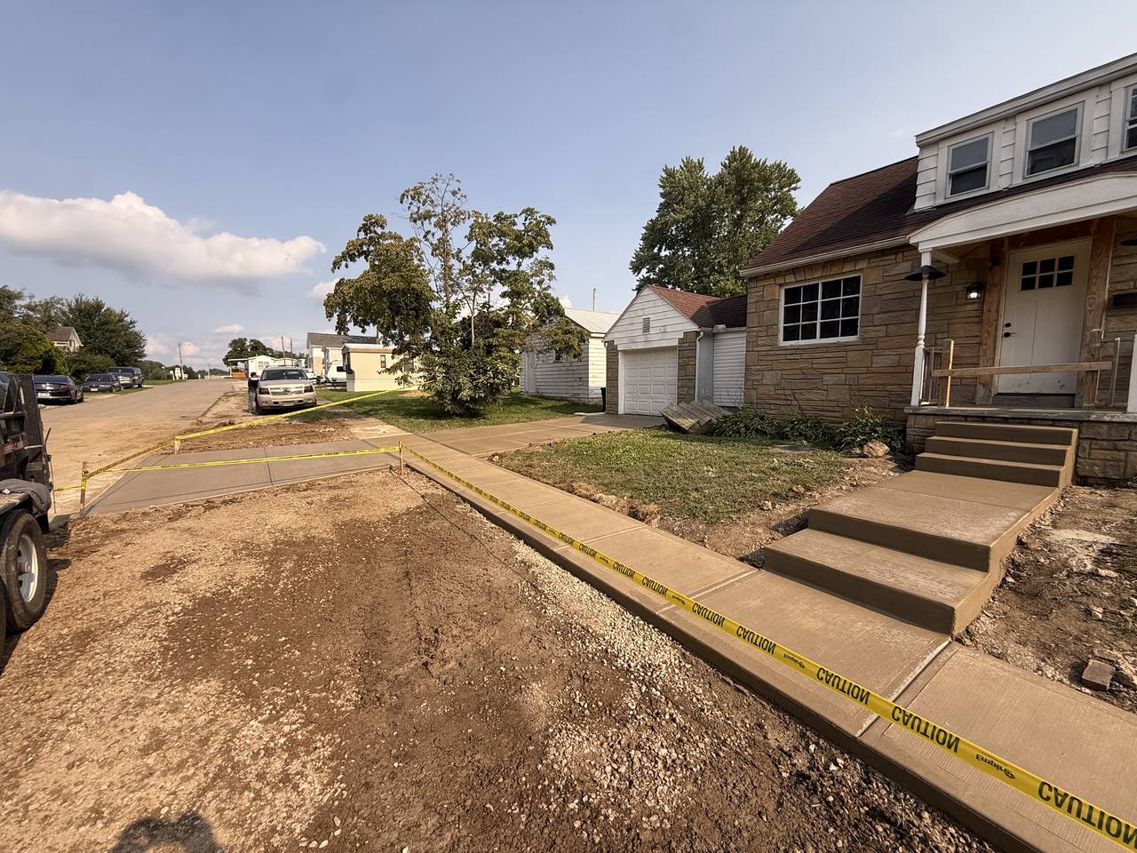 Concrete sidewalk and entry steps at a mobile home community office